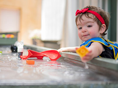 Child experimenting with water